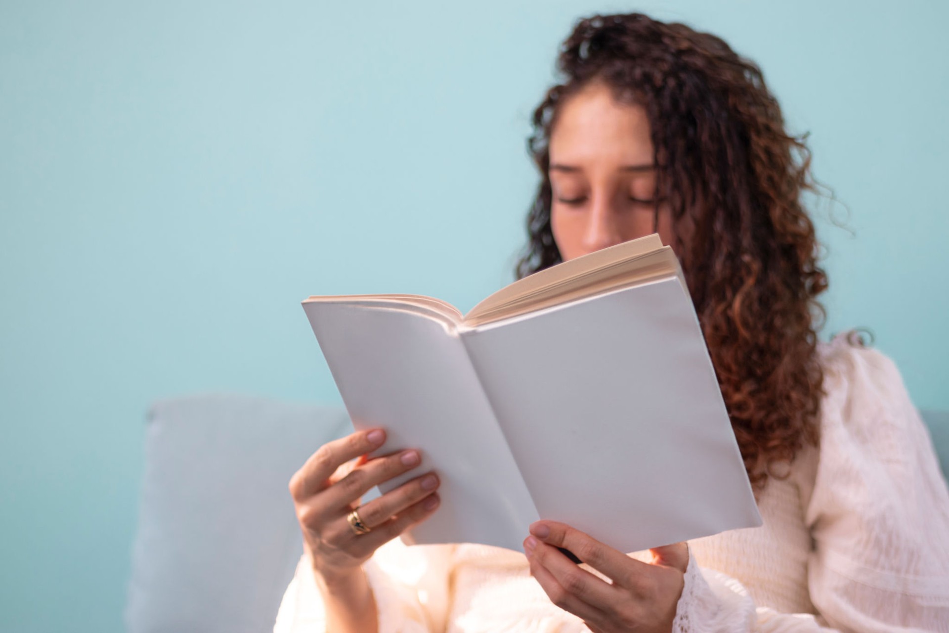 Curly girl reading a book mock up style